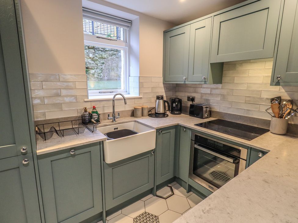 A kitchen with a sink and appliances at West View Leasgill near Milnthorpe