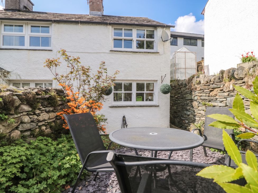 An outdoor space with a table and chairs at Bay Tree Cottage in Ambleside