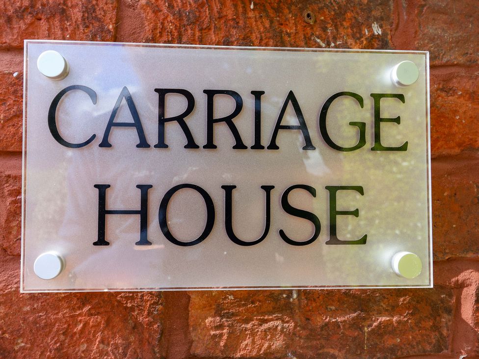A sign displaying 'Carriage House' at Carriage House in Capesthorne near Chelford