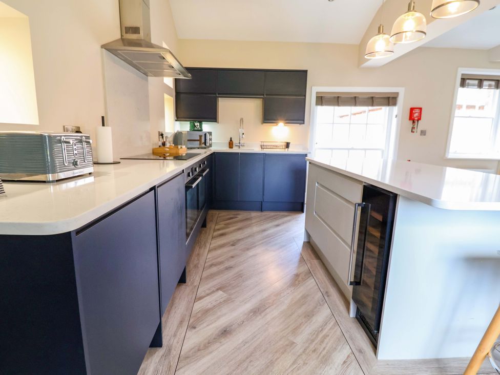 A kitchen with appliances and counter space at Carriage House in Capesthorne near Chelford