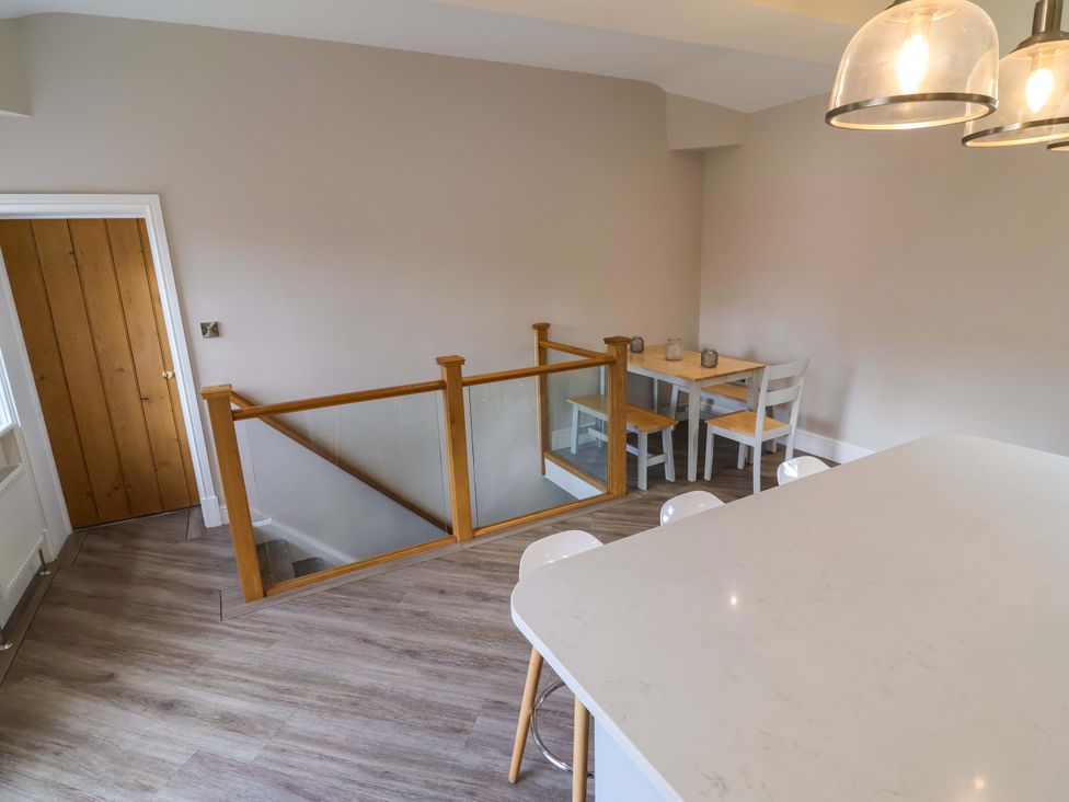 A dining area with a table and chairs at Carriage House near Chelford