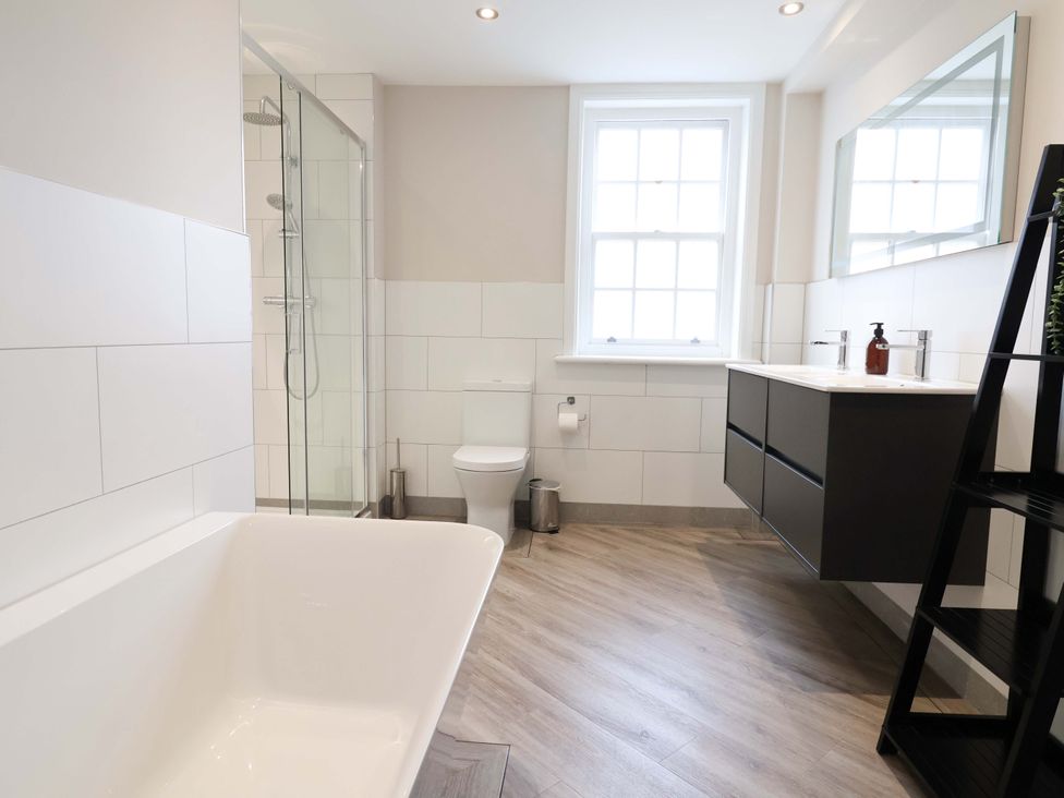 A bathroom with bathtub, shower, sink, and toilet at Carriage House in Capesthorne near Chelford