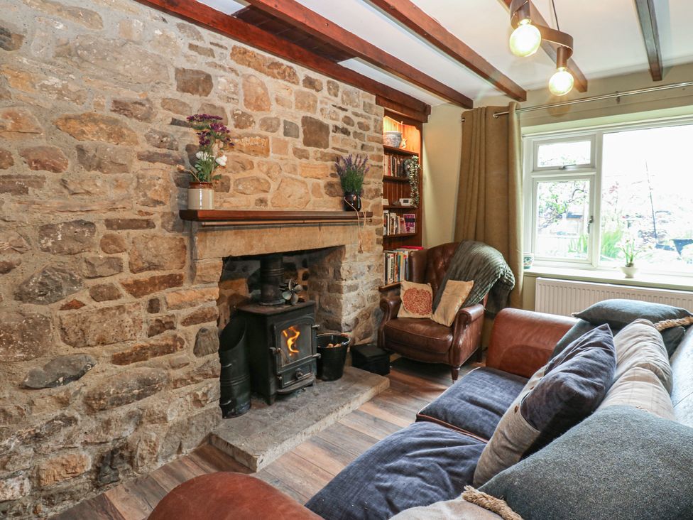 A living room with a sofa and fireplace at Banklands in Barnard Castle