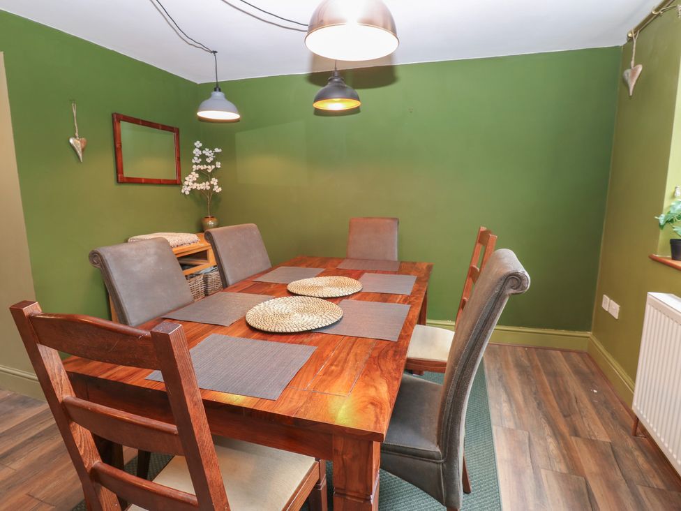 A dining room with a wooden table and chairs at Banklands in Barnard Castle