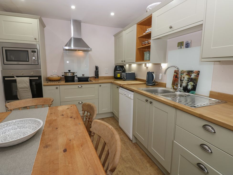 A kitchen with a table and chairs at Banklands in Barnard Castle