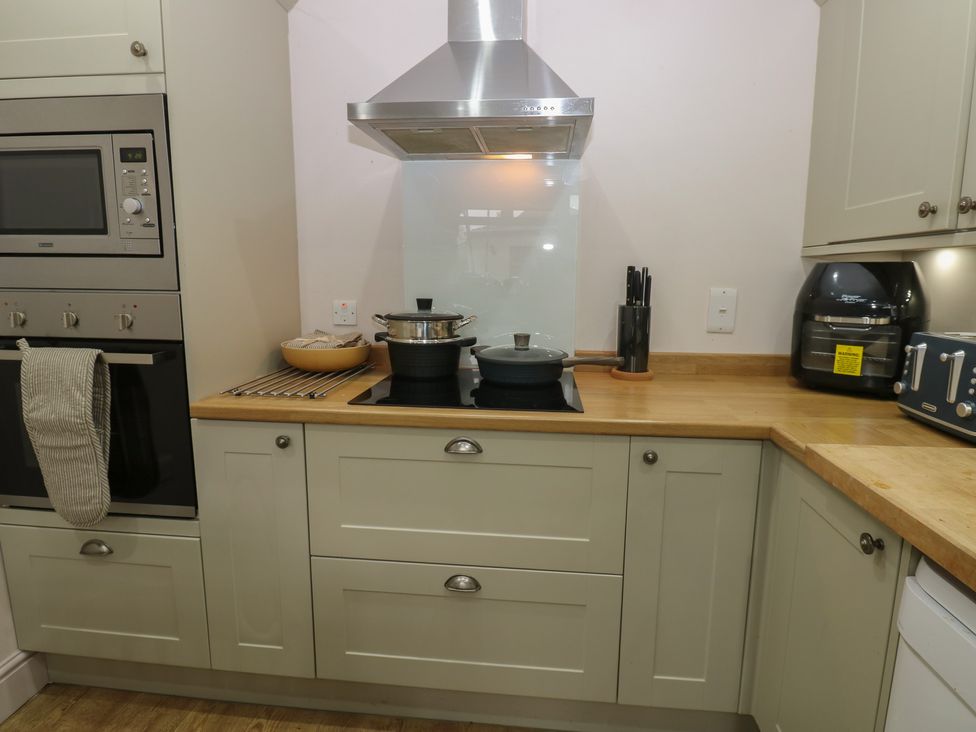 A kitchen with appliances and cooking utensils at Banklands in Barnard Castle