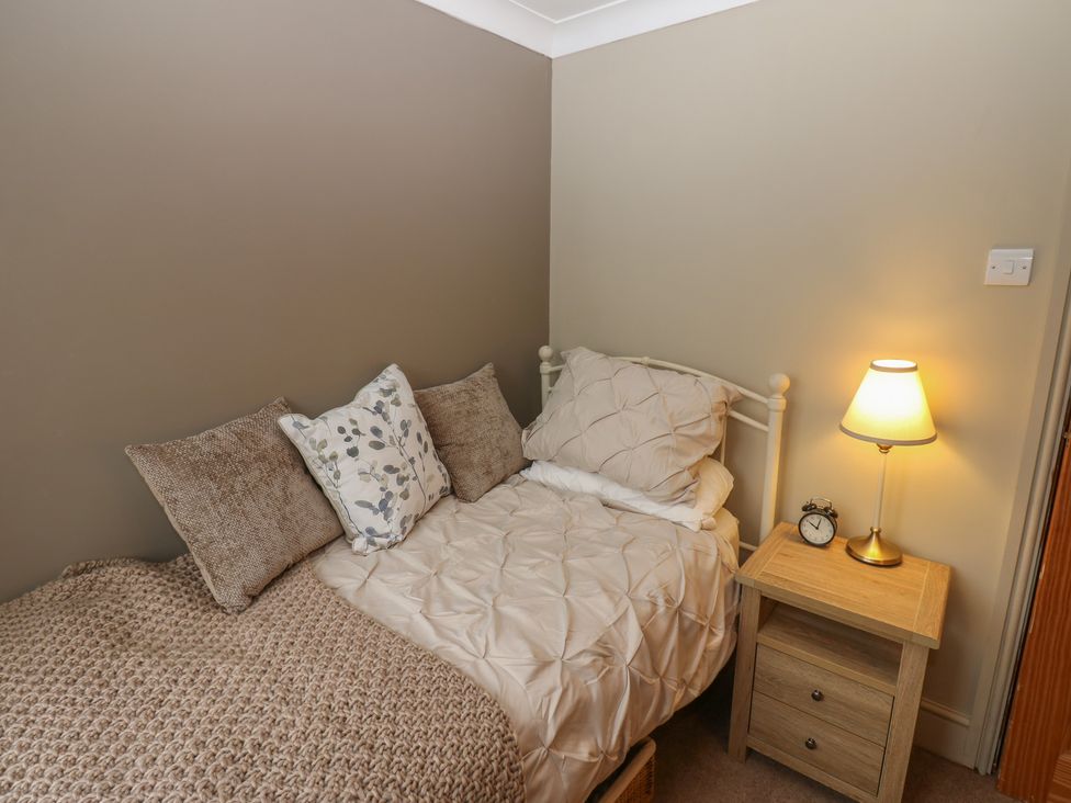 A bedroom with a bed and nightstand at Banklands in Barnard Castle