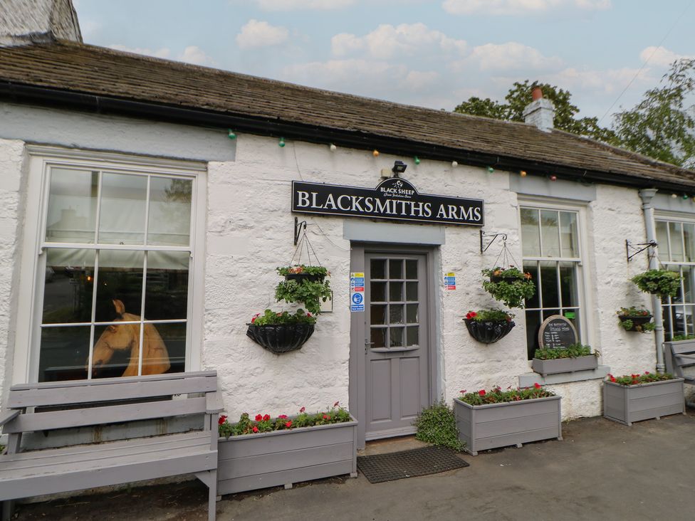 A pub exterior with signage and flower pots at Blacksmiths Arms in Barnard Castle