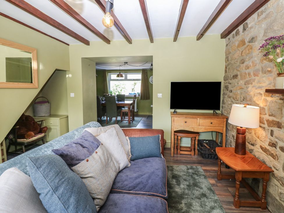 A snug with a sofa and television at Banklands Mickleton, Teesdale