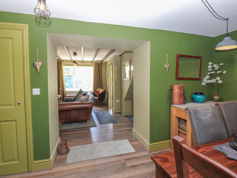 A living room with a sofa and armchair at Banklands in Mickleton, Teesdale