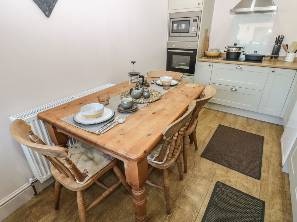 A kitchen with a dining table and chairs at Banklands Mickleton, Teesdale