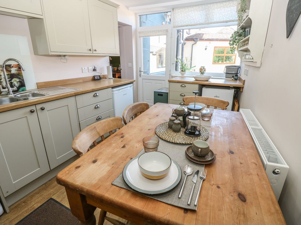 A kitchen with a wooden table and chairs at Banklands in Mickleton, Teesdale