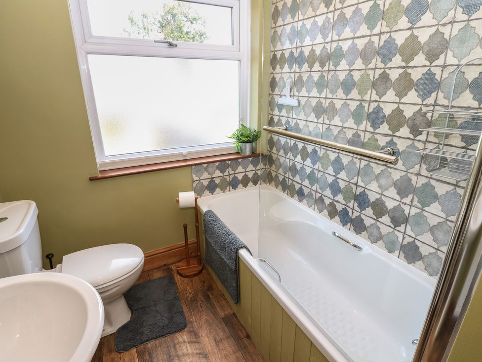 A bathroom with a bathtub and toilet at Banklands Mickleton, Teesdale