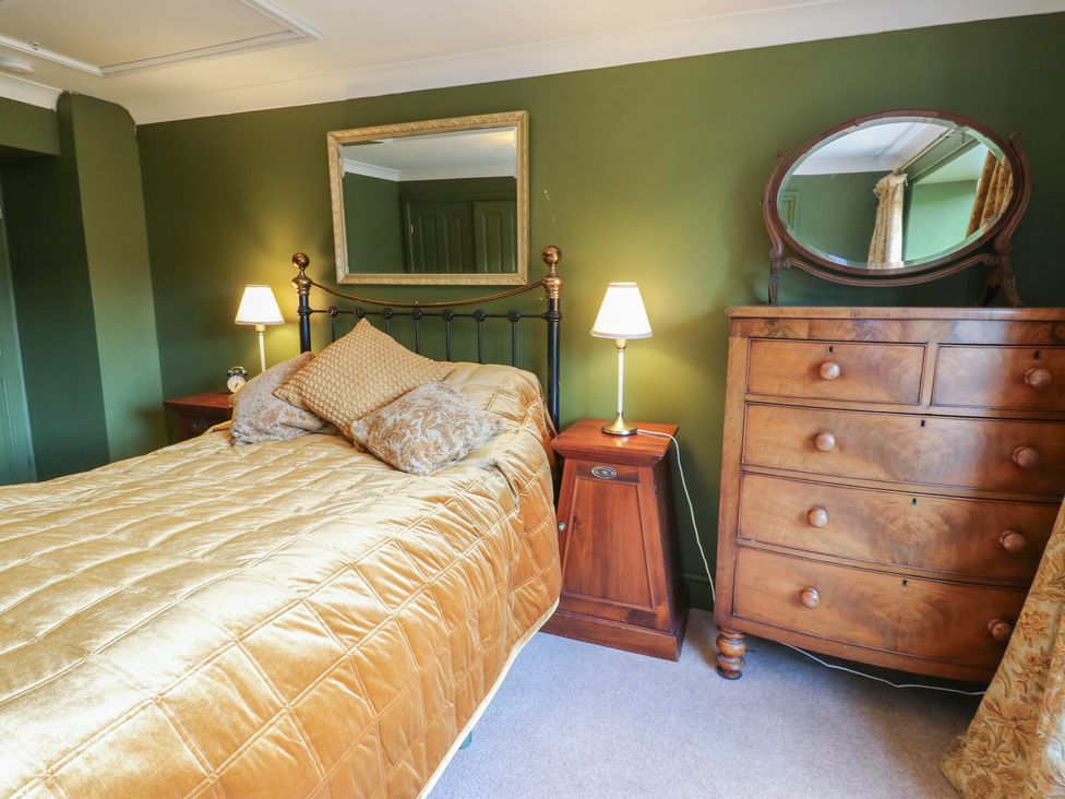 A bedroom with a bed and lamp at Banklands Mickleton, Teesdale