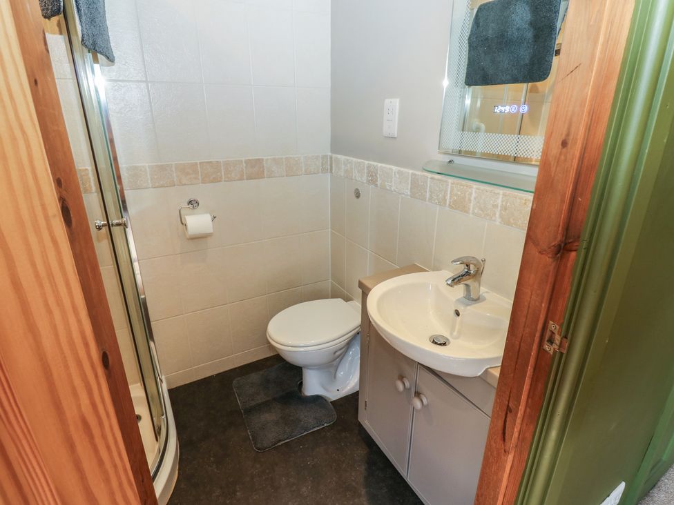 A bathroom featuring a shower, toilet, and sink at Banklands, Mickleton, Teesdale