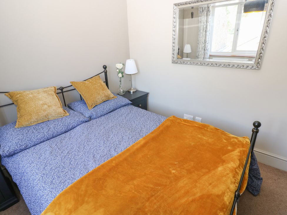 A bedroom with a bed and nightstand at Banklands Mickleton, Teesdale