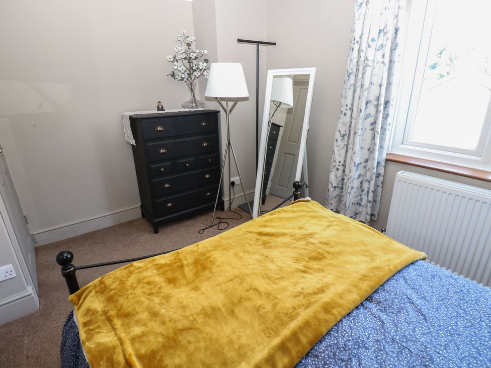 A bedroom with a bed and a chest of drawers at Banklands in Mickleton, Teesdale