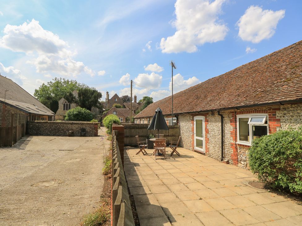 An outdoor area with a patio set at Byre Cottage 3 Sullington near Storrington