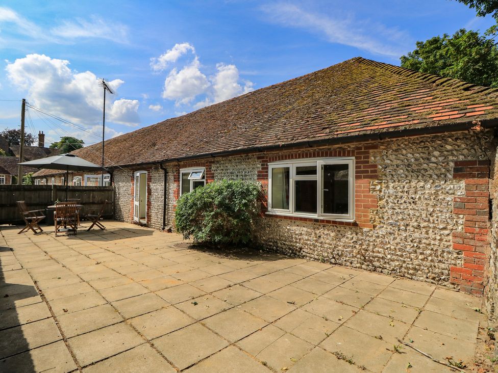An outdoor patio with seating at Byre Cottage 3 Sullington near Storrington