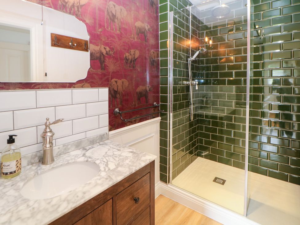 A bathroom with a shower and sink at Church View in Buxton
