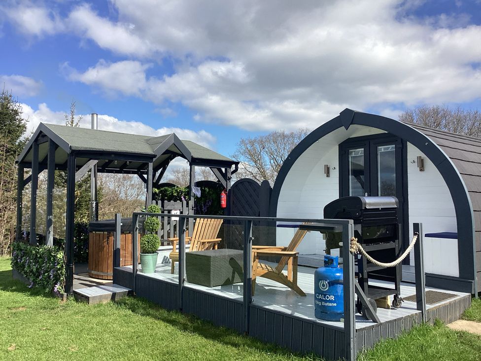 An outdoor area with furniture and barbecue at Cherry Pod Hookagate near Meole Brace