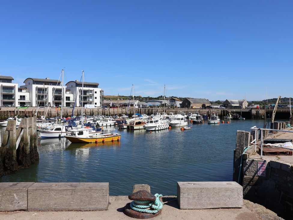 A harbor with boats and buildings at Flat F 