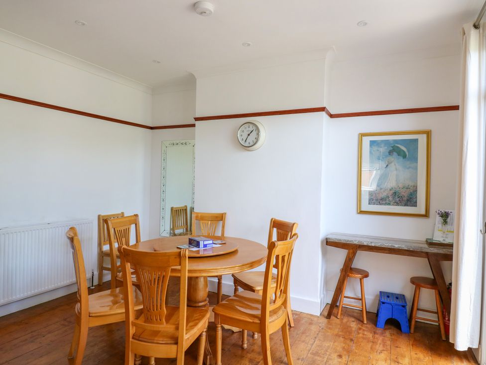 A dining room with a table and chairs at Ninety Eight in Southend-On-Sea