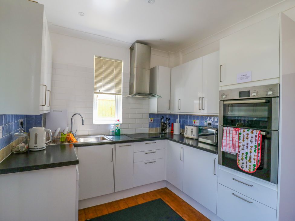 A kitchen with cabinets and appliances at Ninety Eight, Southend-On-Sea