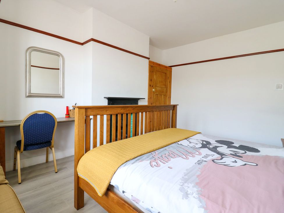 A bedroom with a bed and desk at Ninety Eight Southend-On-Sea