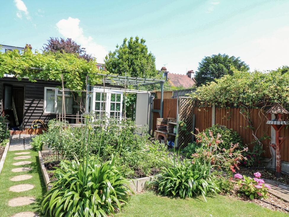 A garden with a shed and pathway at Ninety Eight in Southend-On-Sea
