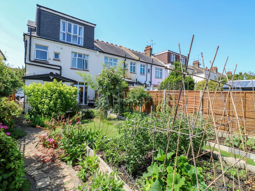 A garden with vegetable beds and pathway at Ninety Eight in Southend-On-Sea