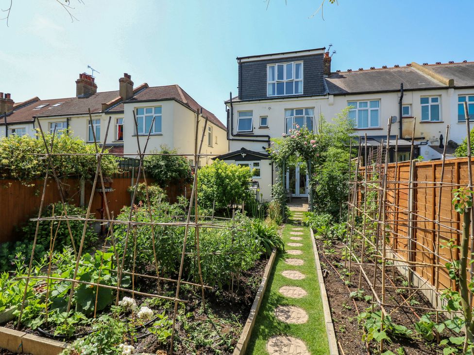 A garden with vegetable plants and a pathway at Ninety Eight in Southend-On-Sea