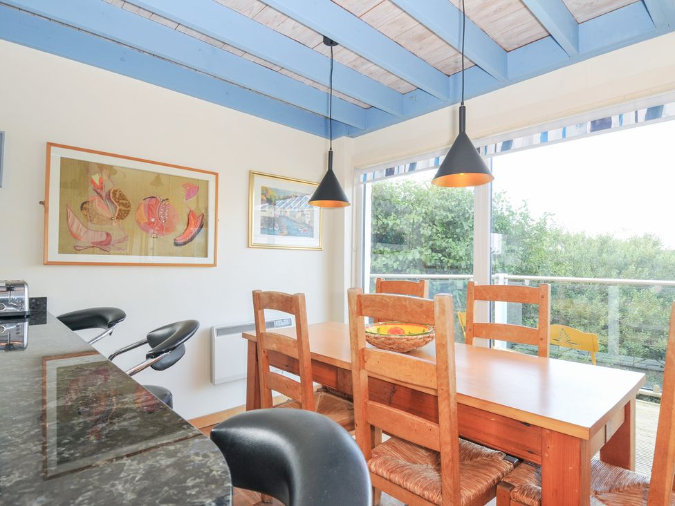A dining area with a table and chairs at Beachside in Polzeath