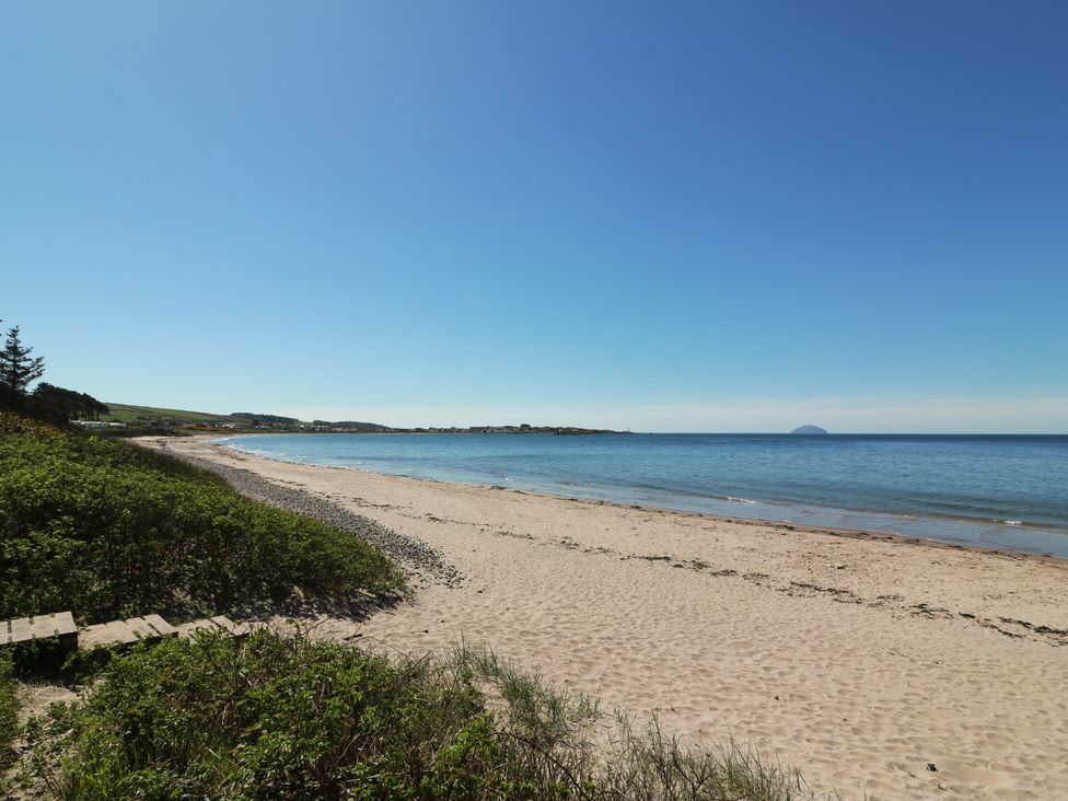 A beach with sand and water at Rothiemay in Maidens