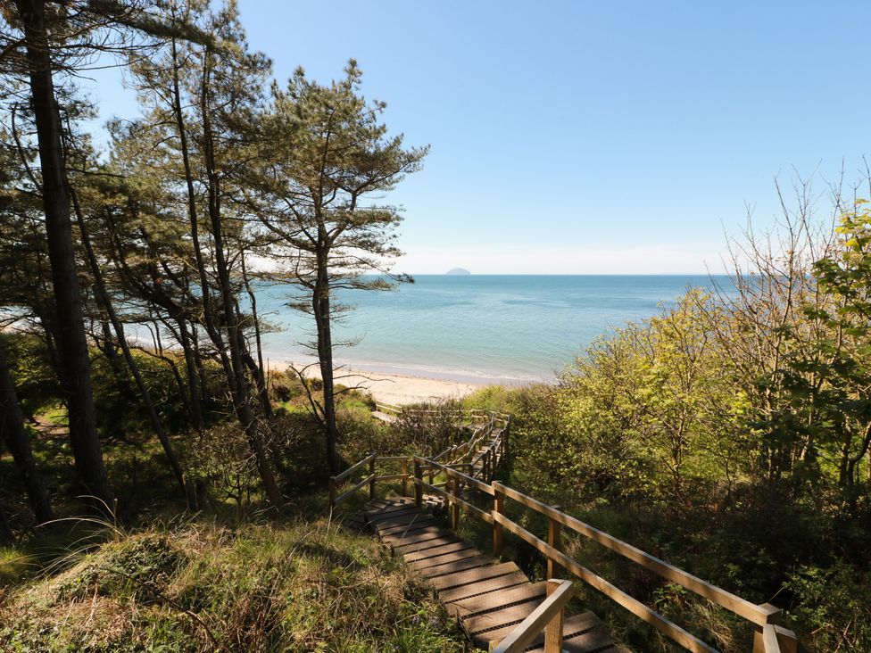A view of the sea and beach from a wooden path at Rothiemay in Maidens
