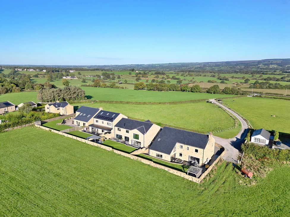 An aerial view of houses and fields at Archstone House, Langho, Lancashire