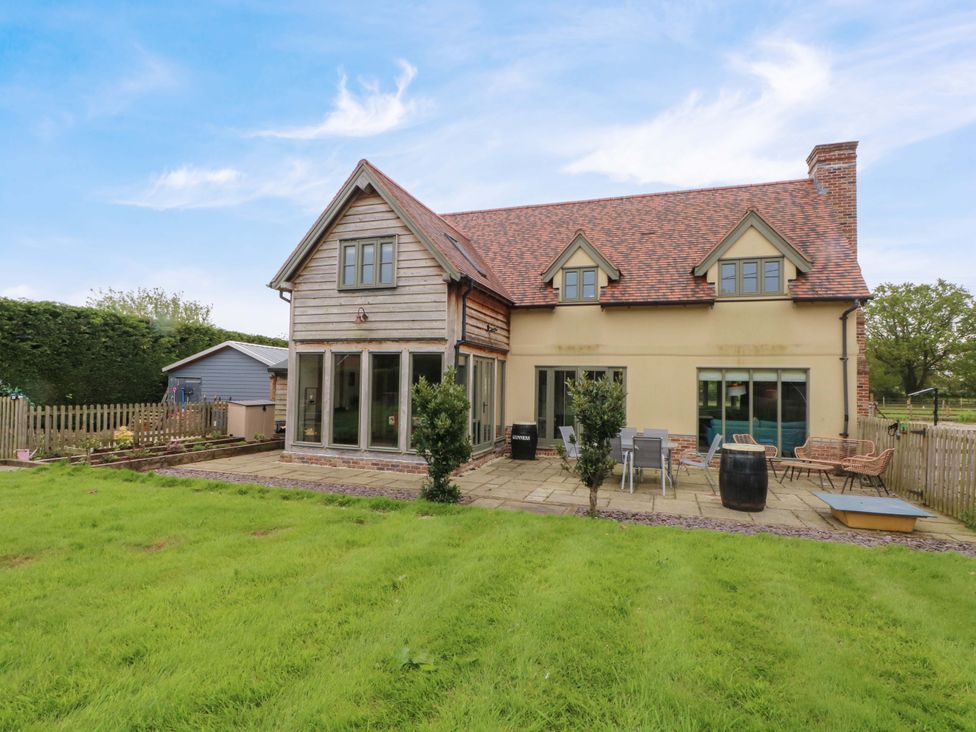 An outdoor area with a house and garden at Gayton Stables in Heswall