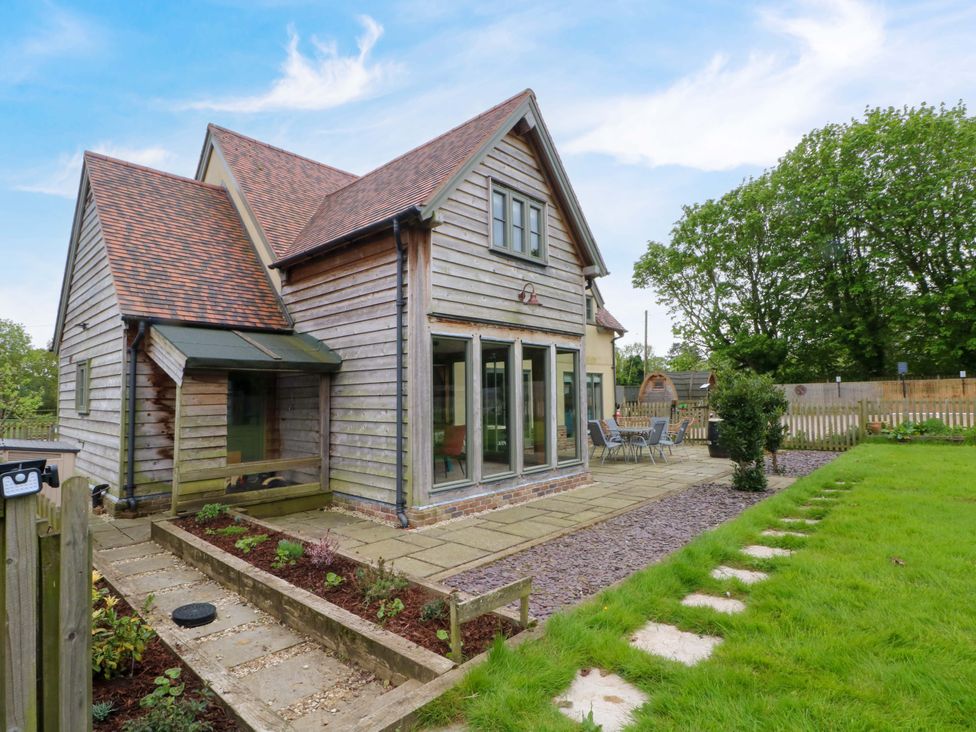A house with a garden and patio at Gayton Stables in Heswall