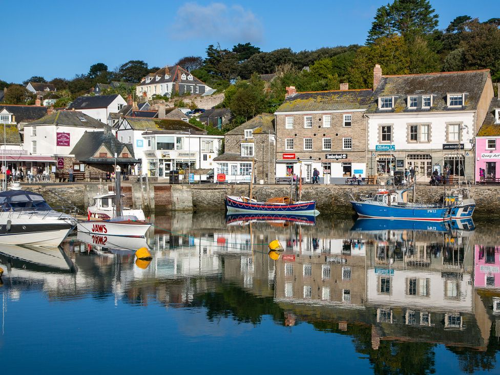A waterfront view with boats and buildings at Trelowen St Issey near Padstow