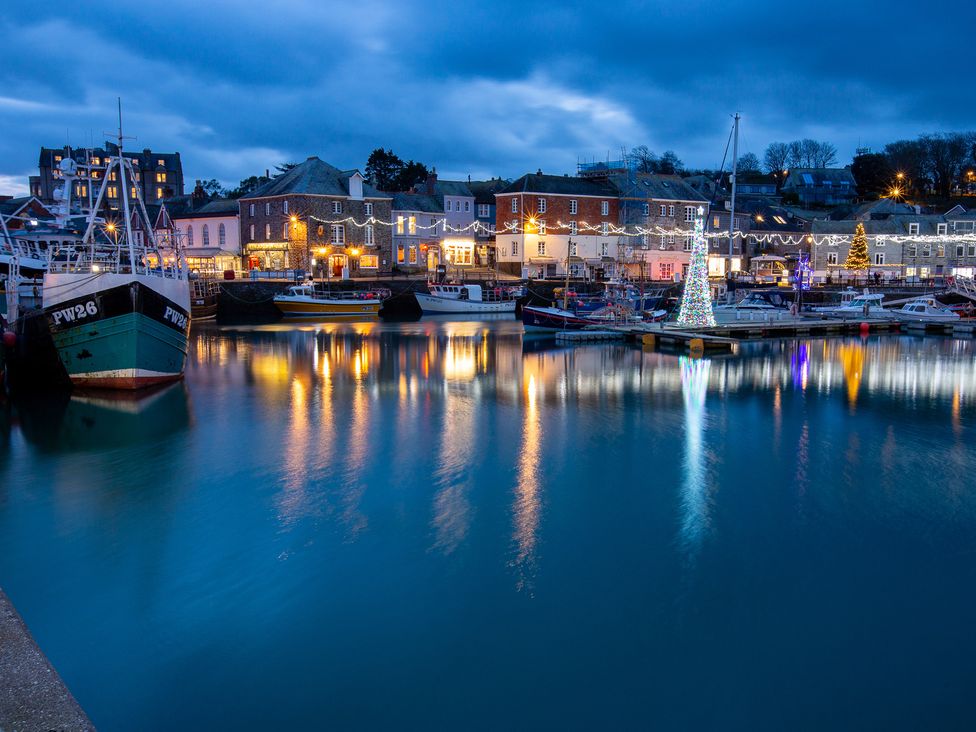 A harbor with boats and reflections in water at Trelowen St Issey near Padstow