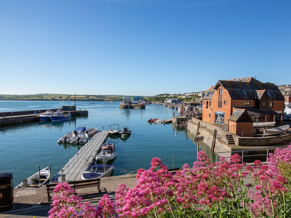 A marina with boats and a building at Trelowen in St Issey near Padstow