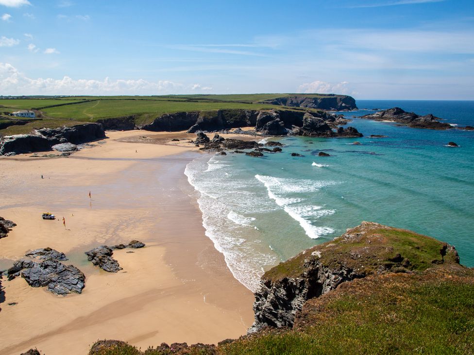 A beach with waves and rocks at Trelowen in St Issey near Padstow
