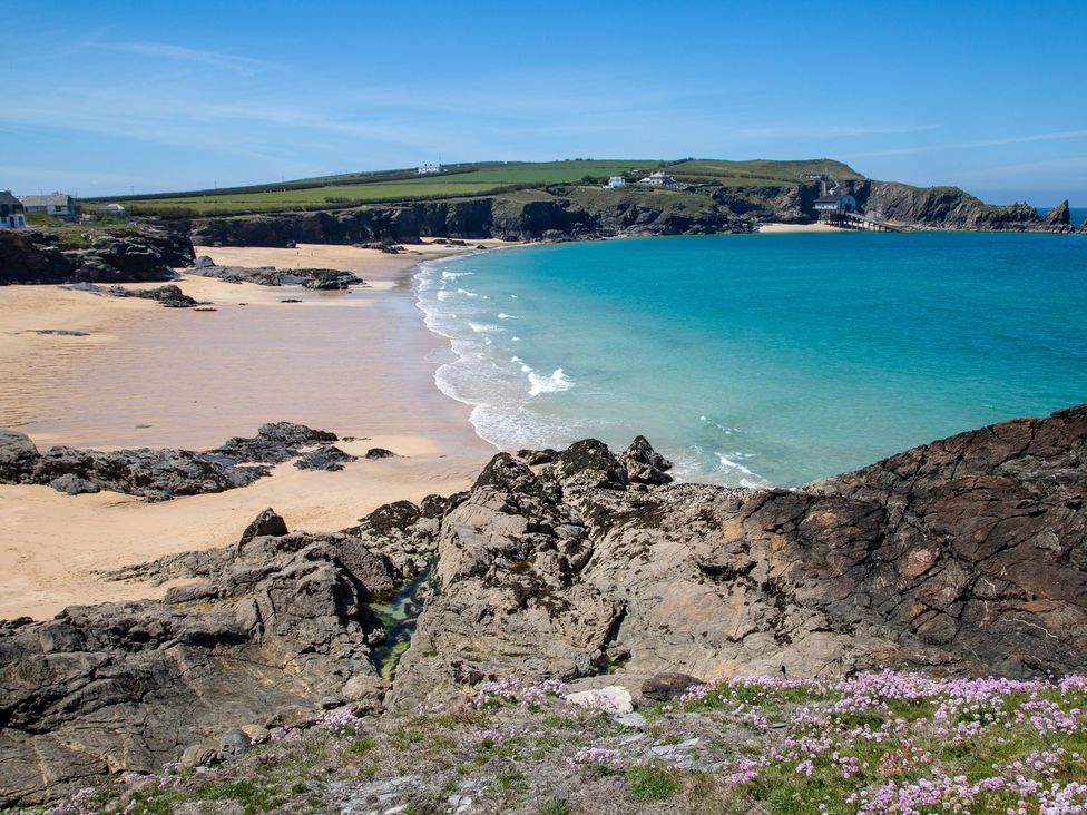 A beach with ocean waves and rocks at Trelowen St Issey near Padstow