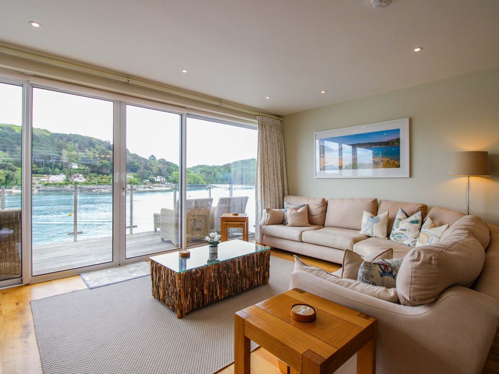 A living room with a sofa and coffee table at Villa 1, Estura in Salcombe