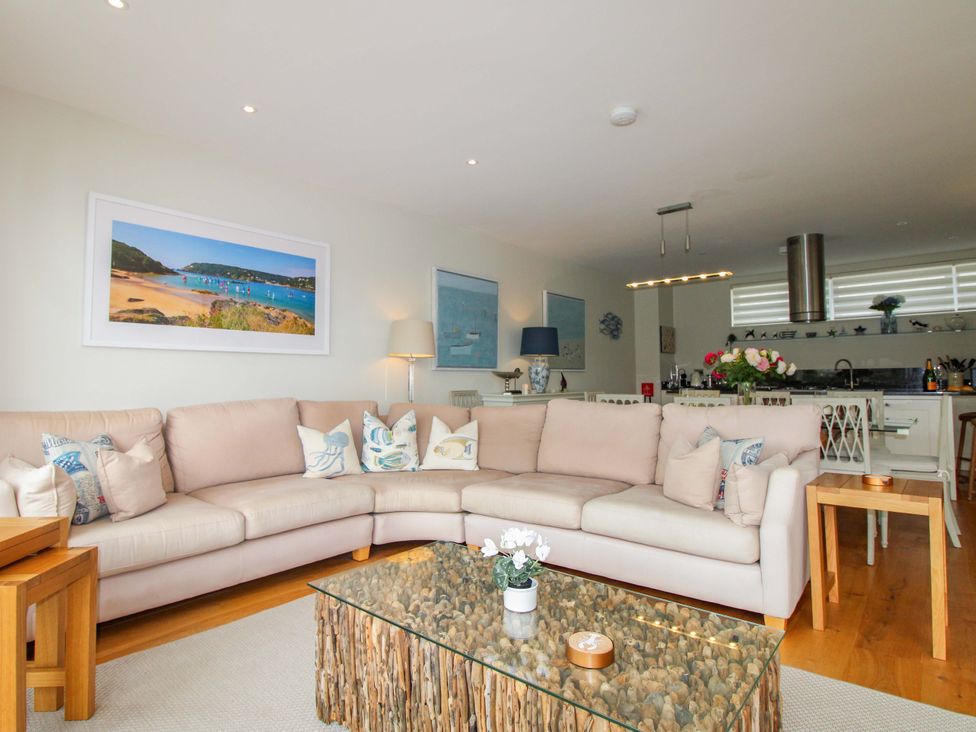 A living room with a sofa and coffee table at Villa 1, Estura in Salcombe