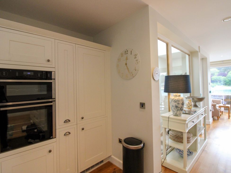 A kitchen with cabinets and built-in oven at Villa 1, Estura, Salcombe