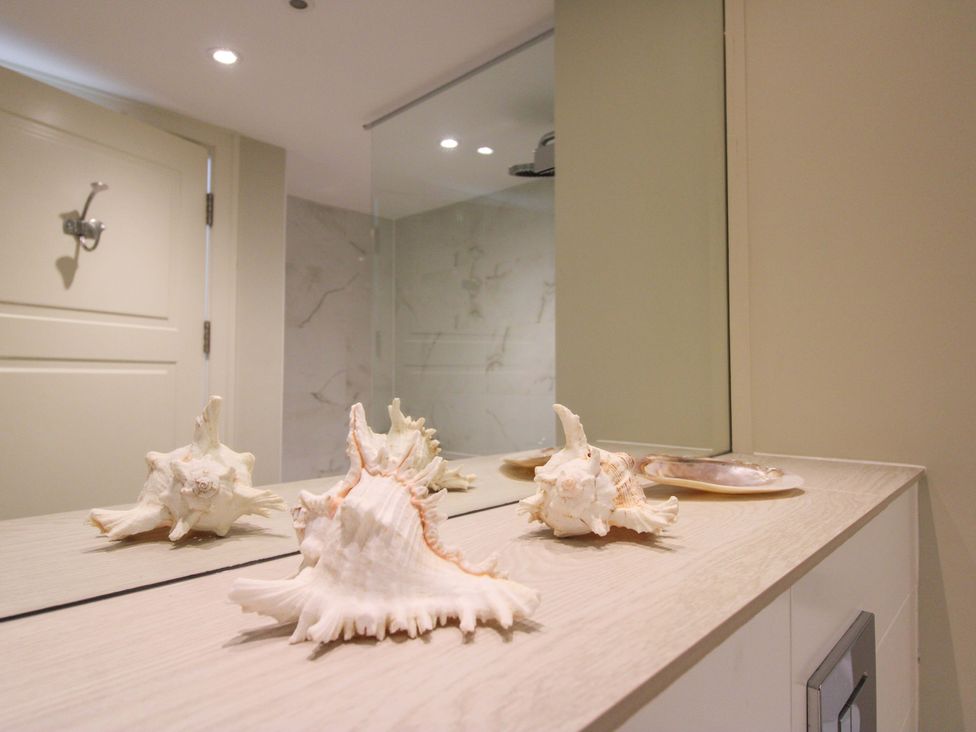 A bathroom with shells on a countertop at Villa 1, Estura in Salcombe