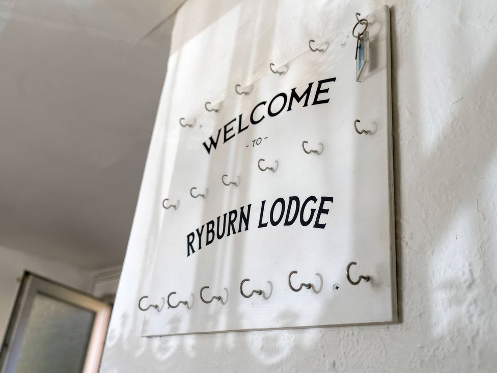 A welcome sign with hooks at Ryburn Lodge in Bridlington