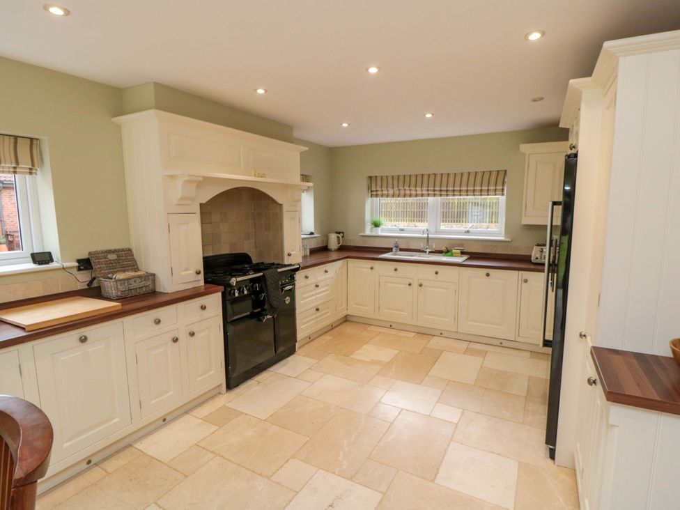 A kitchen with cabinets and a cooking range at Wyvill House in Cayton