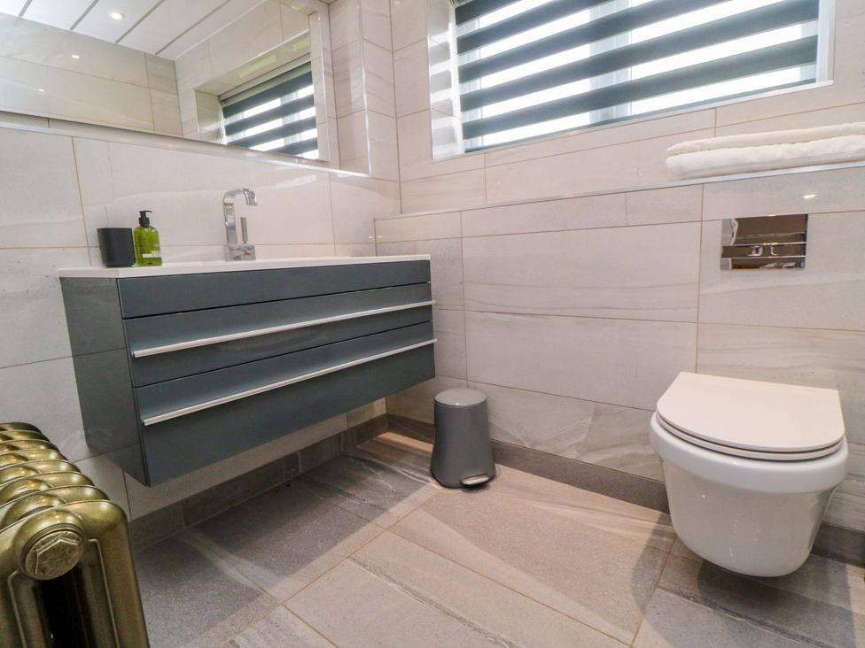 A bathroom with a sink and toilet at Wyvill House in Cayton